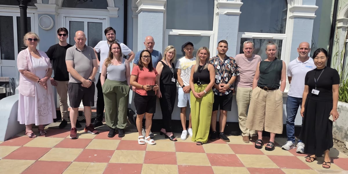 The Castle Accommodation team standing together outside one of our properties